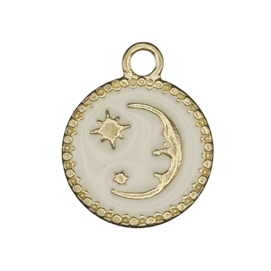 close-up of round white charm with gold crescent moon and stars