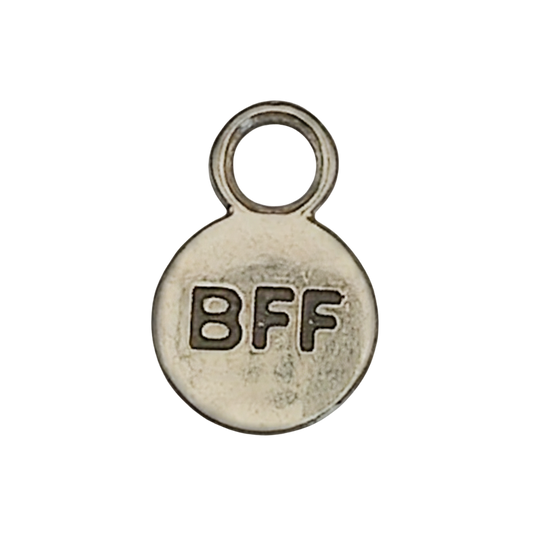 close-up of small silver-tone round charm with 'BFF' text