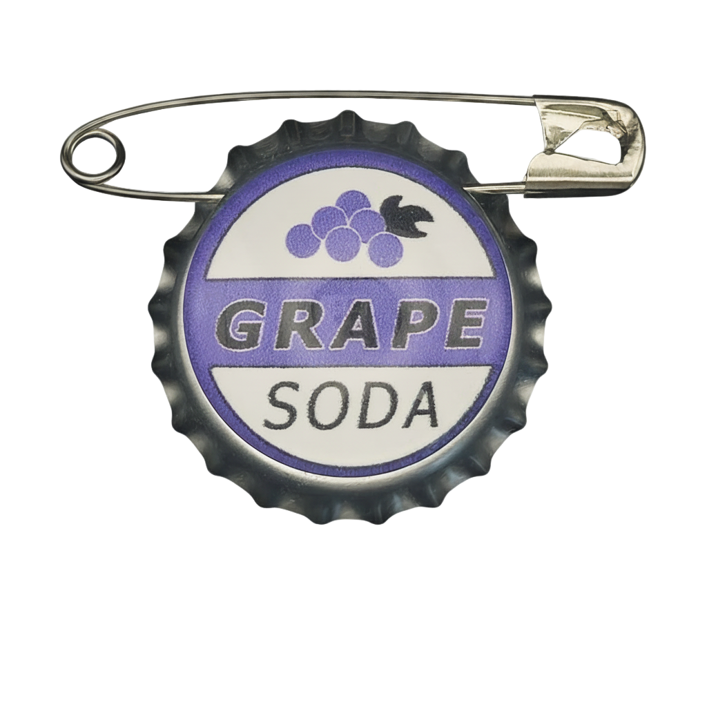 front view of grape soda bottle cap pin with purple and white graphic on black background