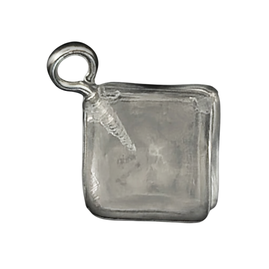 close-up of a square silver ice cube charm on a black background