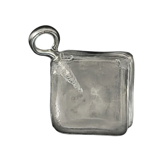 close-up of a square silver ice cube charm on a black background