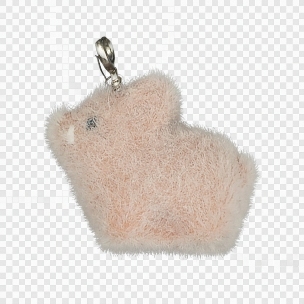 close-up of a small pink fuzzy hamster charm on a black background