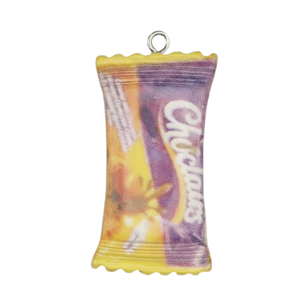 close-up of purple and yellow candy wrapper charm