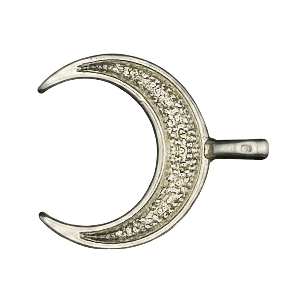 close-up of a silver crescent moon charm with clear pave stones on a black background