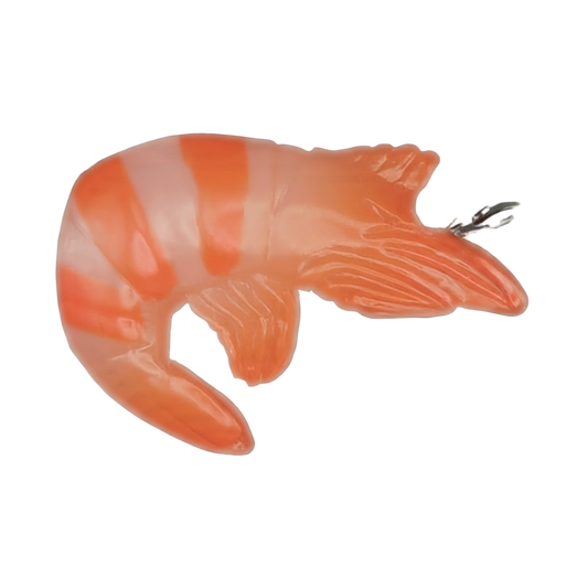 close-up of an orange striped shrimp charm on a black background