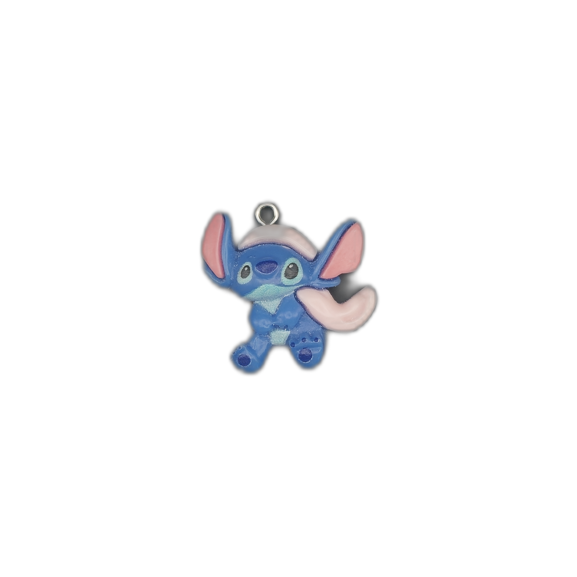 small blue cartoon alien charm with big pink ears centered on black background
