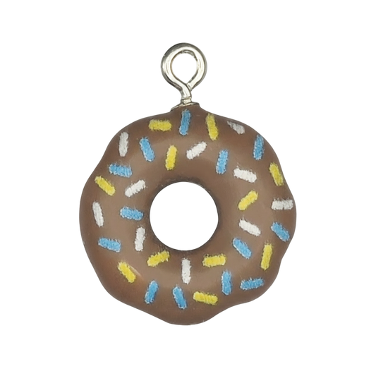 close-up of a brown donut charm with blue, yellow, and white sprinkles on a black background