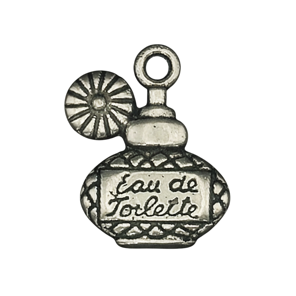 Close-up of a silver-tone perfume bottle charm with the words eau de toilette on a black background.