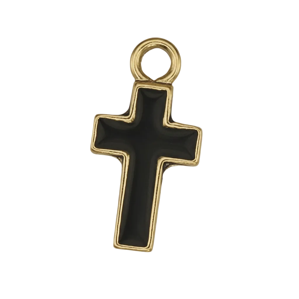 close-up of a small black cross charm with a gold border on a black background