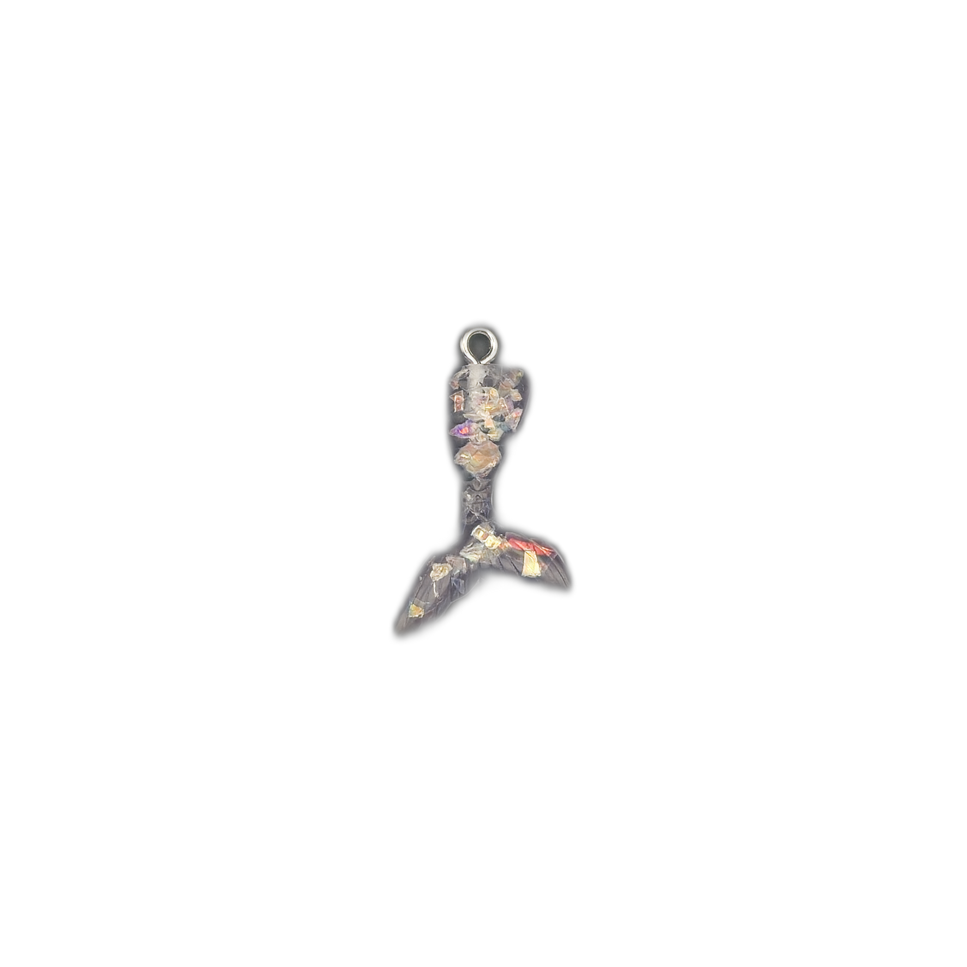 mermaid tail charm with black resin and multicolor flakes centered on black background