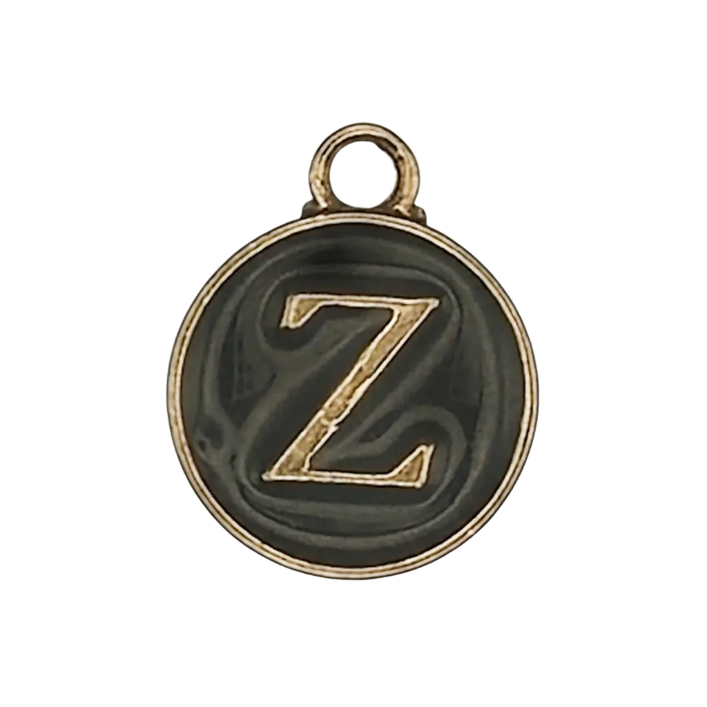 Round black charm with gold letter Z.