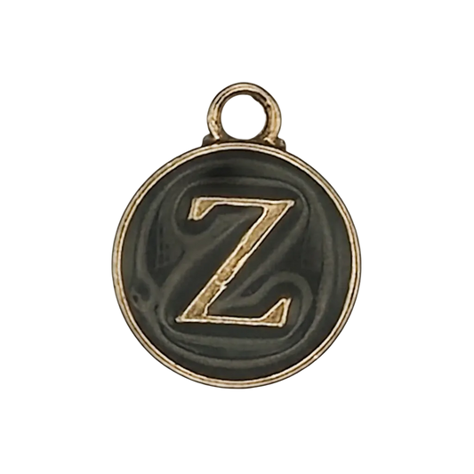 Round black charm with gold letter Z.