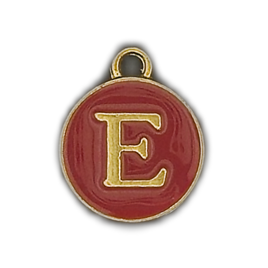 close-up of round red enamel charm with gold letter E and gold border