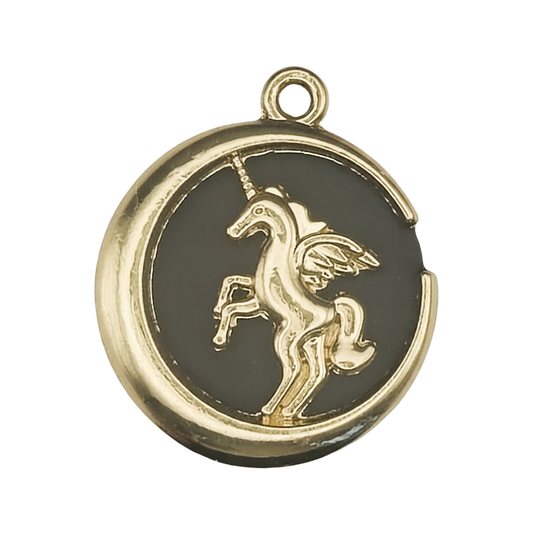 close-up of round gold-tone charm with raised winged unicorn on black background