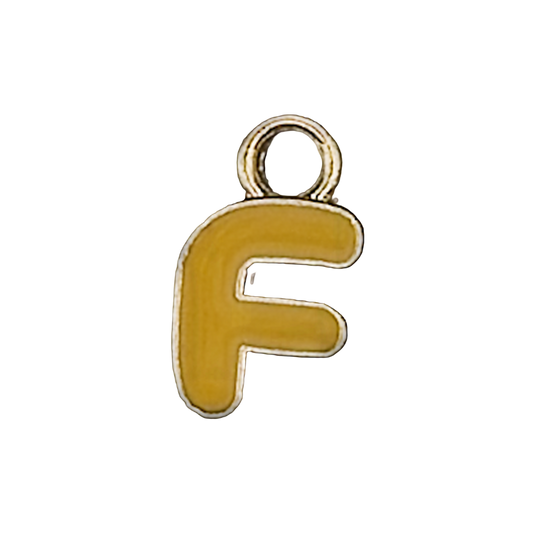 close-up of yellow enamel letter F charm with gold outline on a black background