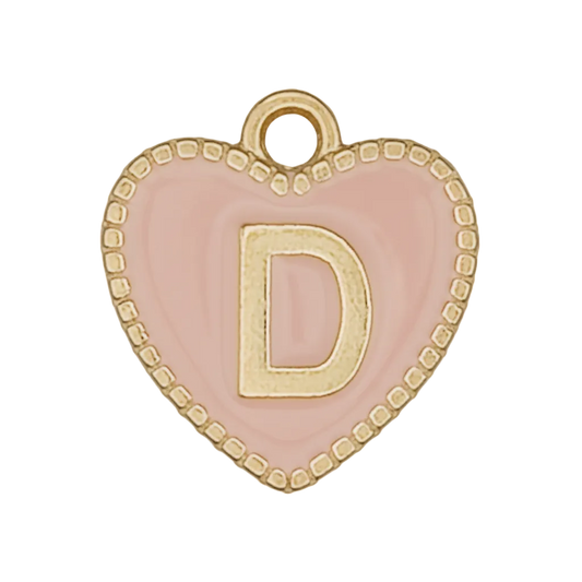 close-up of a pink heart charm with a gold letter D