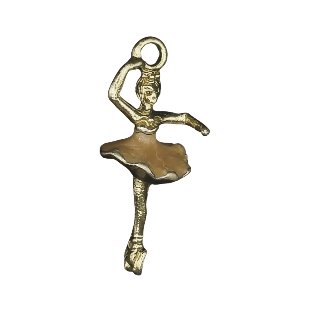 close-up of a gold-tone ballerina charm with a beige tutu on a black background