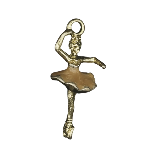 close-up of a gold-tone ballerina charm with a beige tutu on a black background