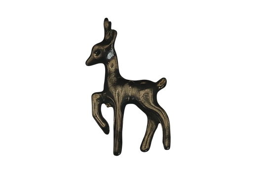 close-up of a small gold deer fawn charm on black background