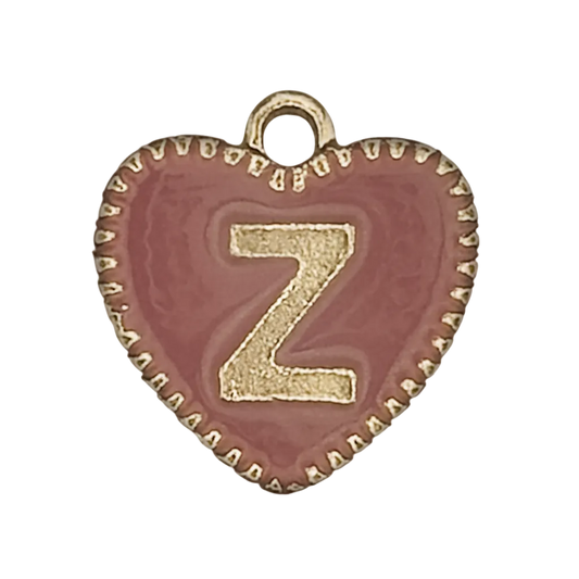 close-up of a pink heart charm with a gold letter Z