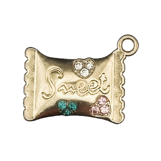 Close-up of gold-tone candy wrapper charm with 'Sweet' and clear, green, and pink crystal hearts on a black background.