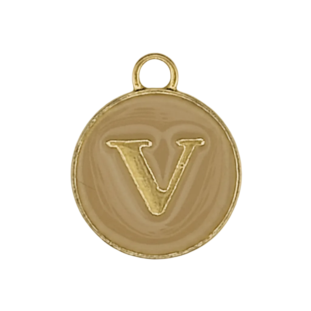 close-up of round gold letter V charm