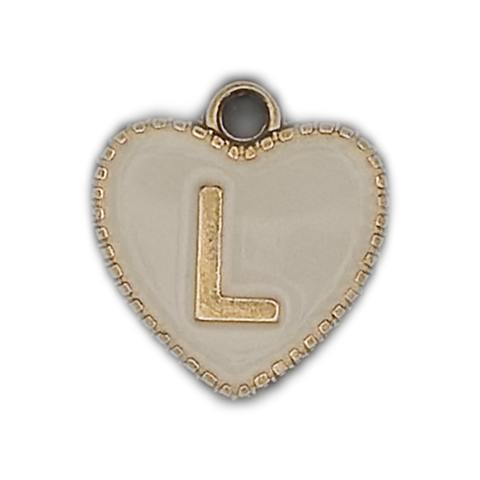 close-up of white heart charm with raised gold letter L and beaded gold edge on black background