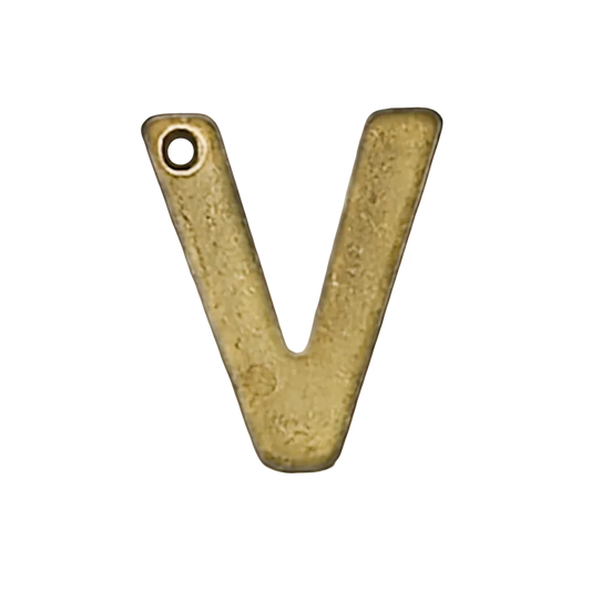 close-up of matte gold letter V charm with a small hole at the upper left on black background