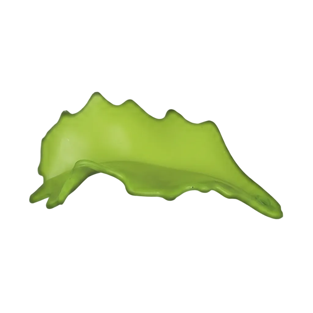 close-up of bright green leaf-shaped charm on black background