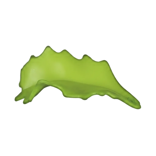 close-up of bright green leaf-shaped charm on black background