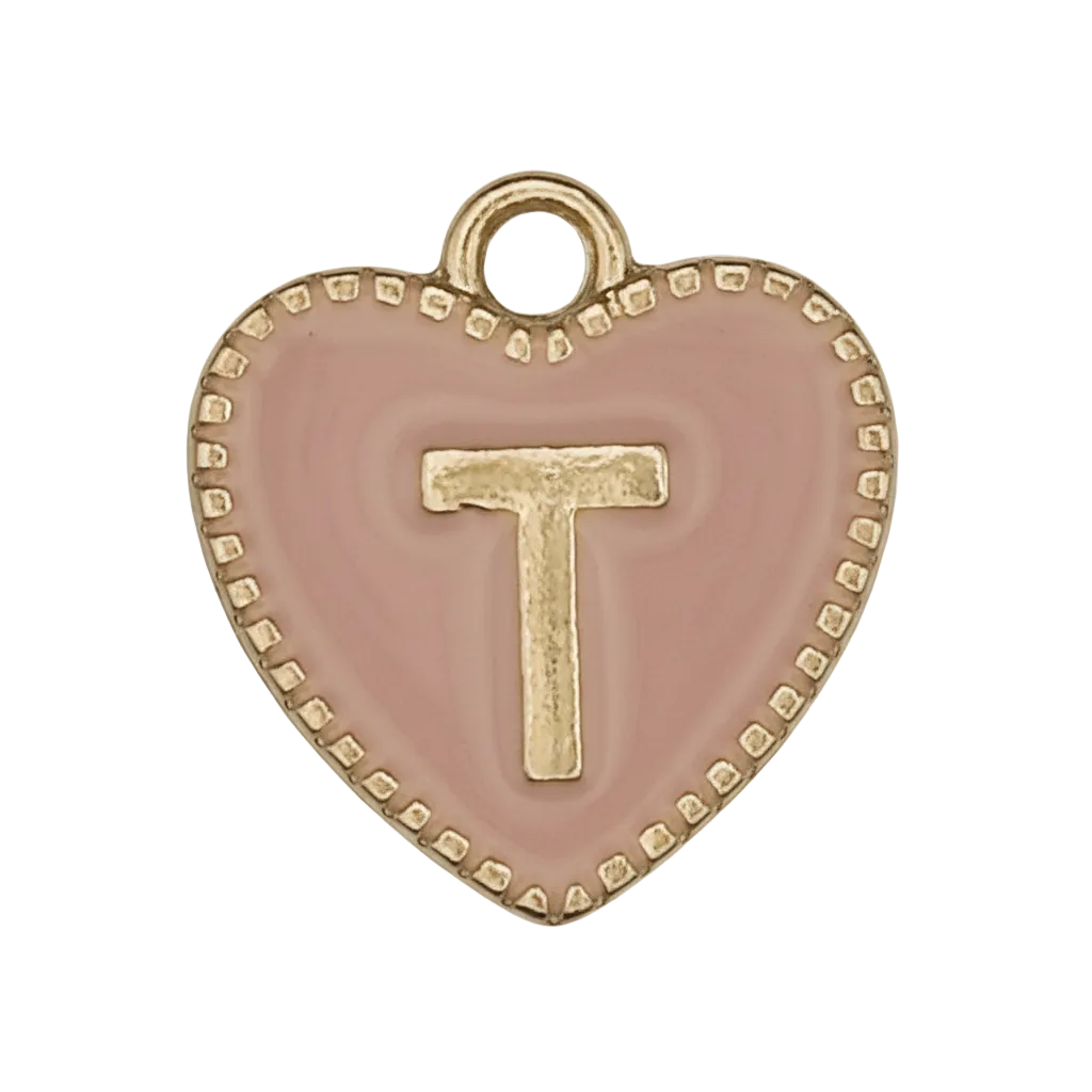 Close-up of pink heart charm with a gold letter T and dotted border.