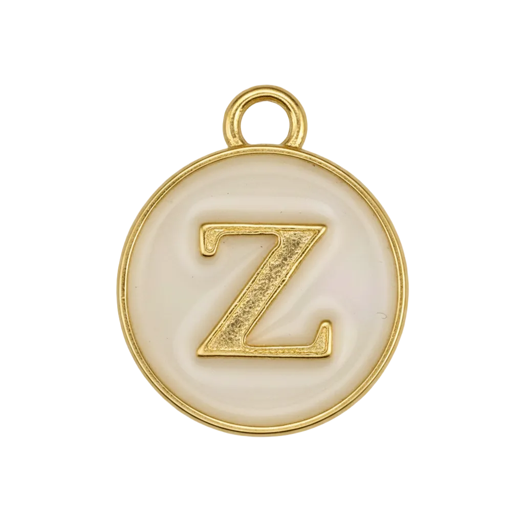 close-up of round cream enamel charm with raised gold letter Z