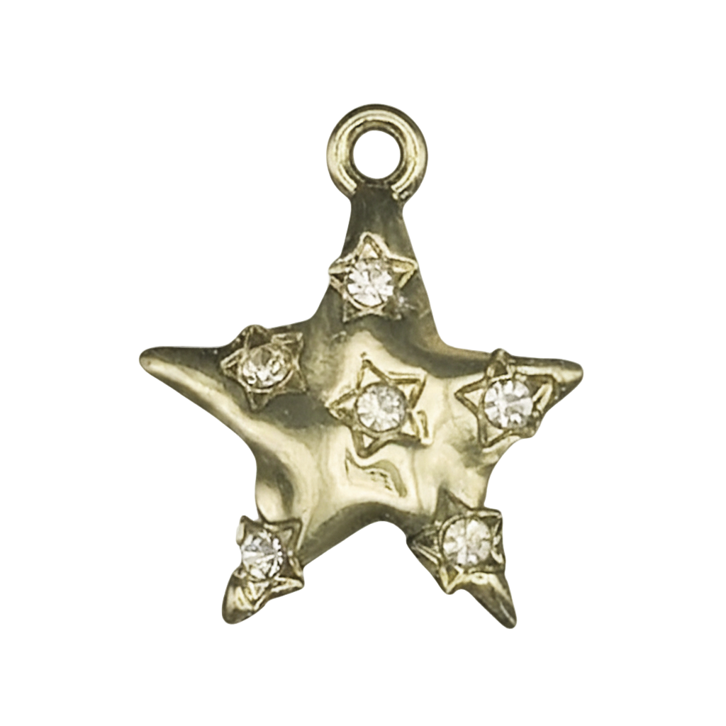 close-up of gold star charm with clear stone accents on black background