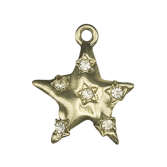 close-up of gold star charm with clear stone accents on black background