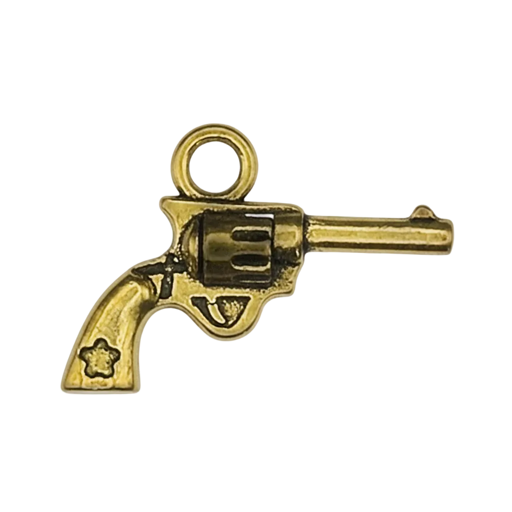 close-up of a small gold revolver charm