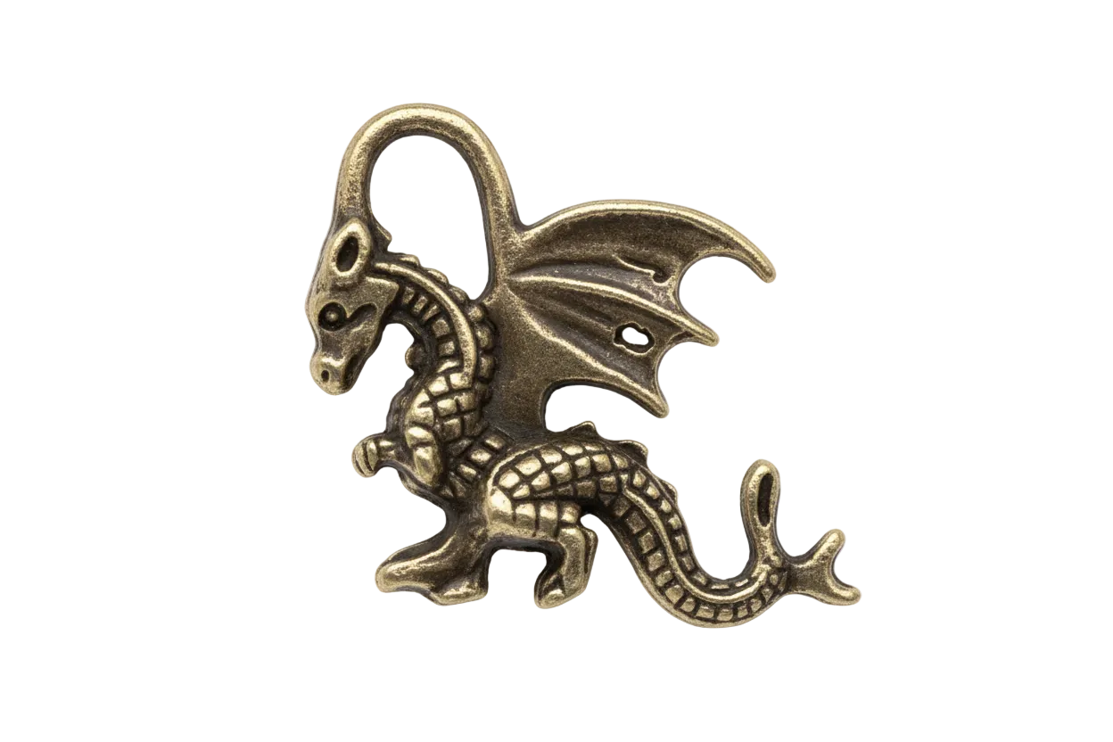 close-up of a small winged dragon metal charm on black background