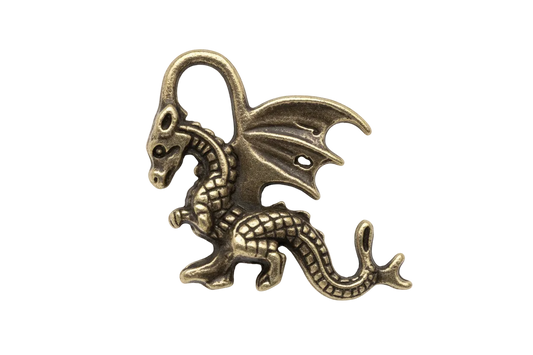 close-up of a small winged dragon metal charm on black background