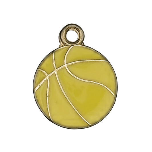 close-up of yellow enamel basketball charm with gold lines on a black background