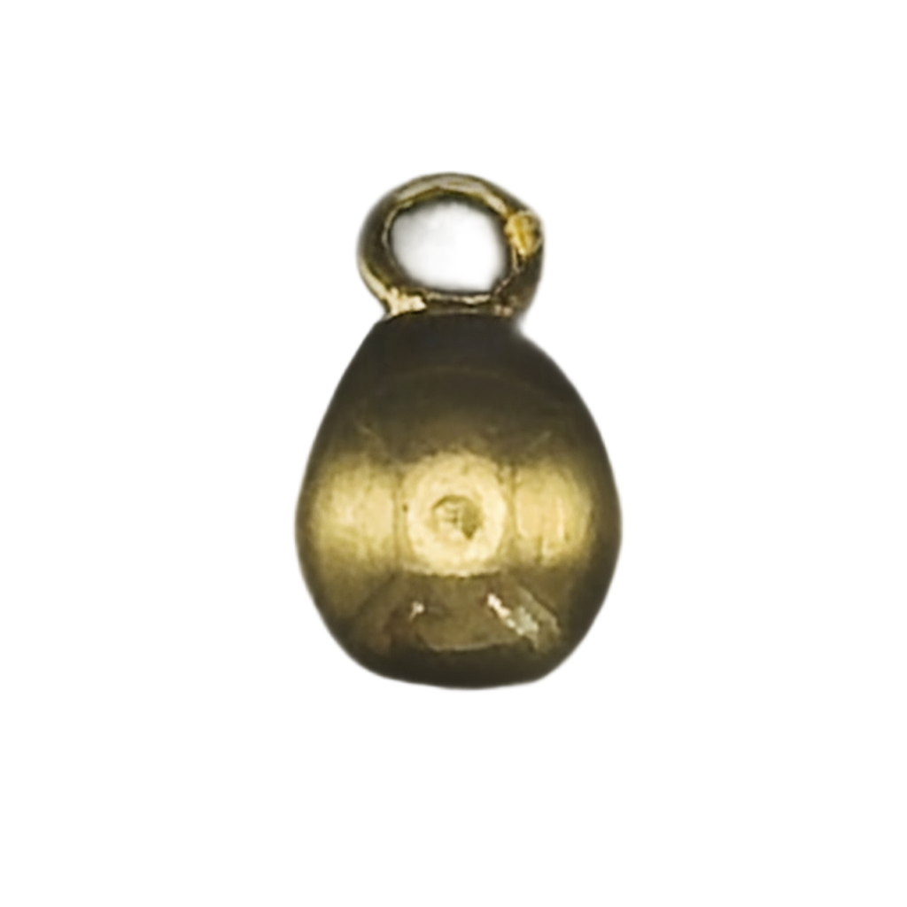 close-up of a small gold teardrop charm on a black background