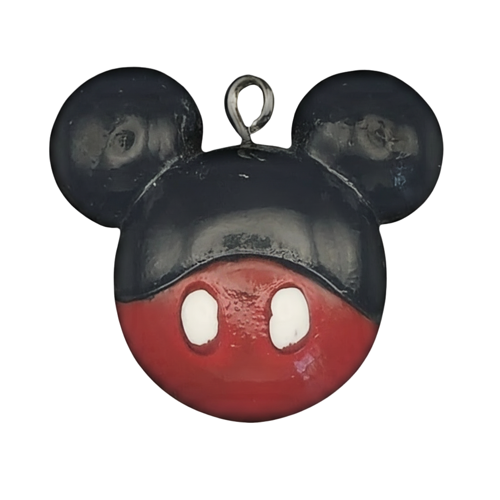 close-up of black and red mouse head charm with white ovals