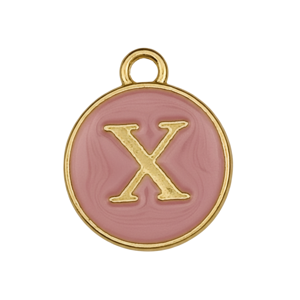 Close-up of round pink enamel charm with gold letter X on black background.