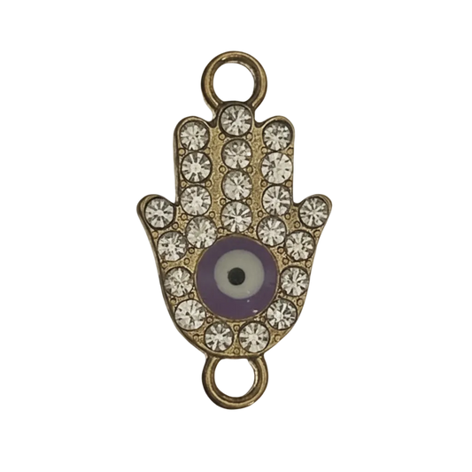 close-up of gold hamsa hand charm with clear rhinestones and purple evil eye