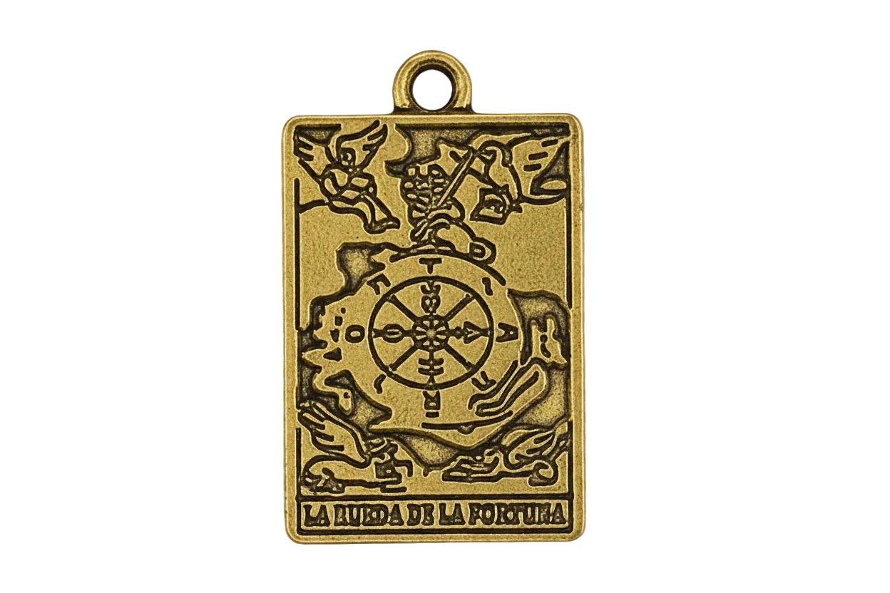 Close-up of rectangular gold-tone tarot charm reading 'La Rueda de la Fortuna' on a black background.