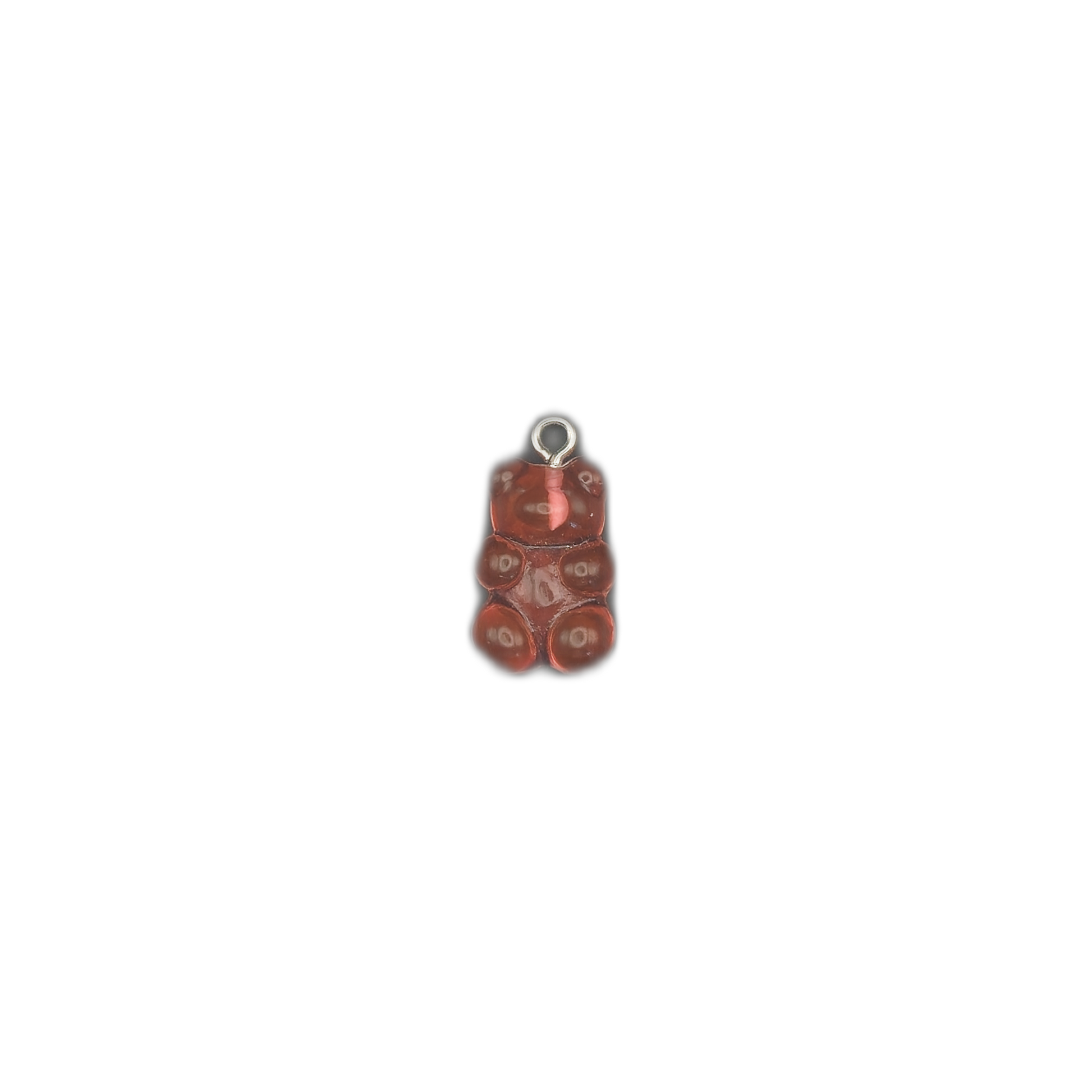 small red gummy bear charm centered on black background