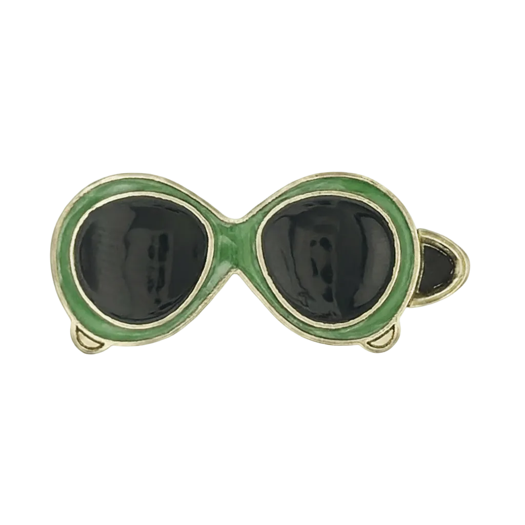 close-up of green-framed black-lens sunglasses charm on a black background