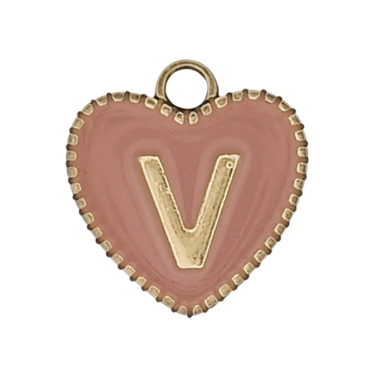 close-up of pink heart charm with gold letter V