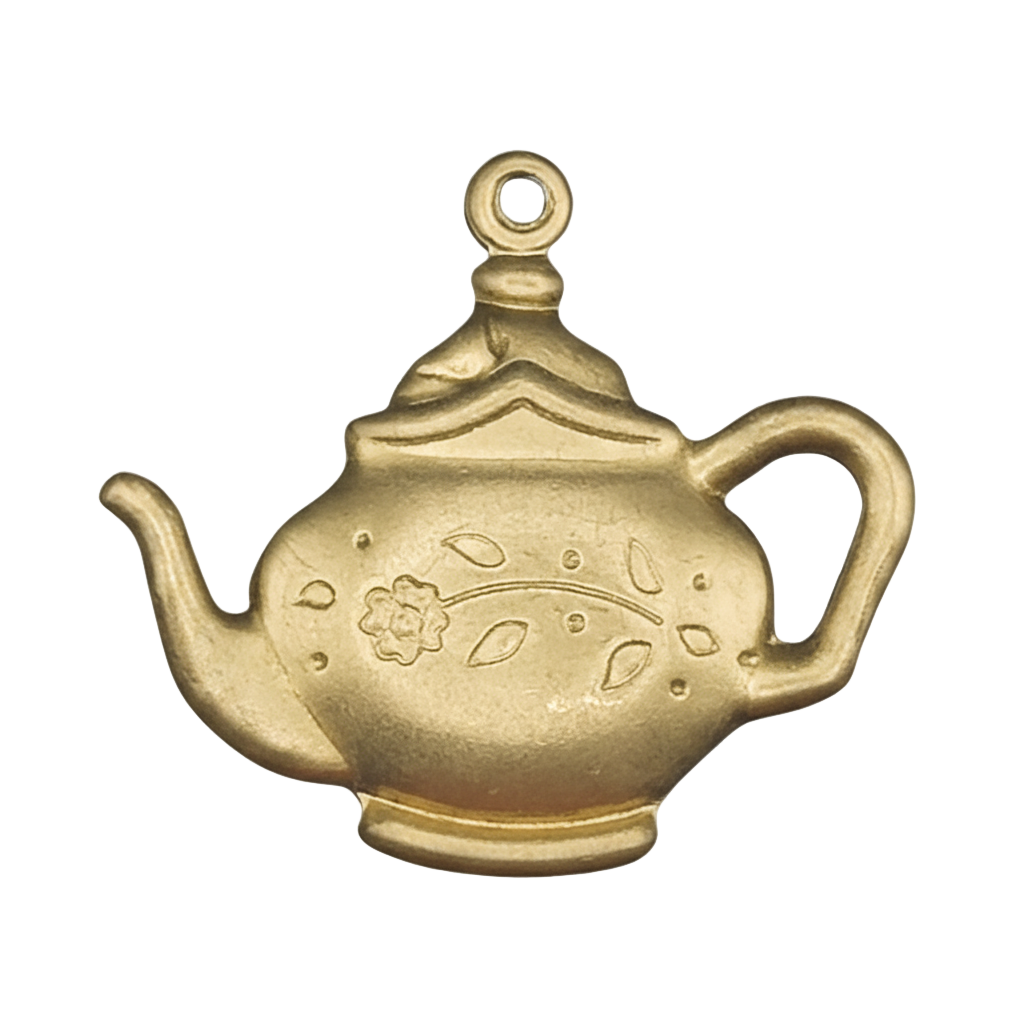 close-up of matte gold teapot charm with floral engraving on a black background
