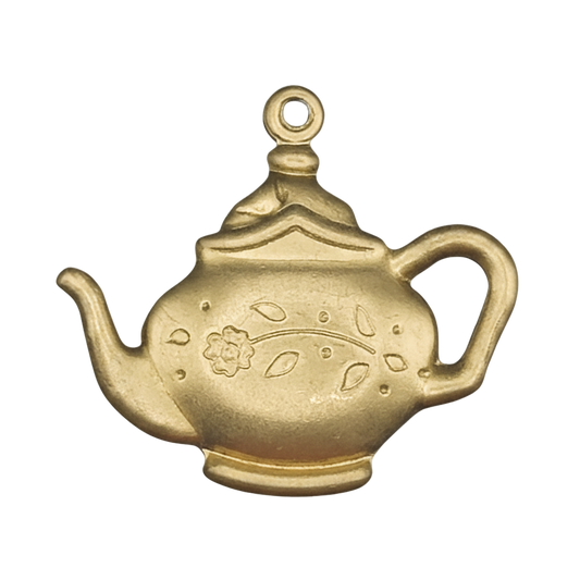 close-up of matte gold teapot charm with floral engraving on a black background