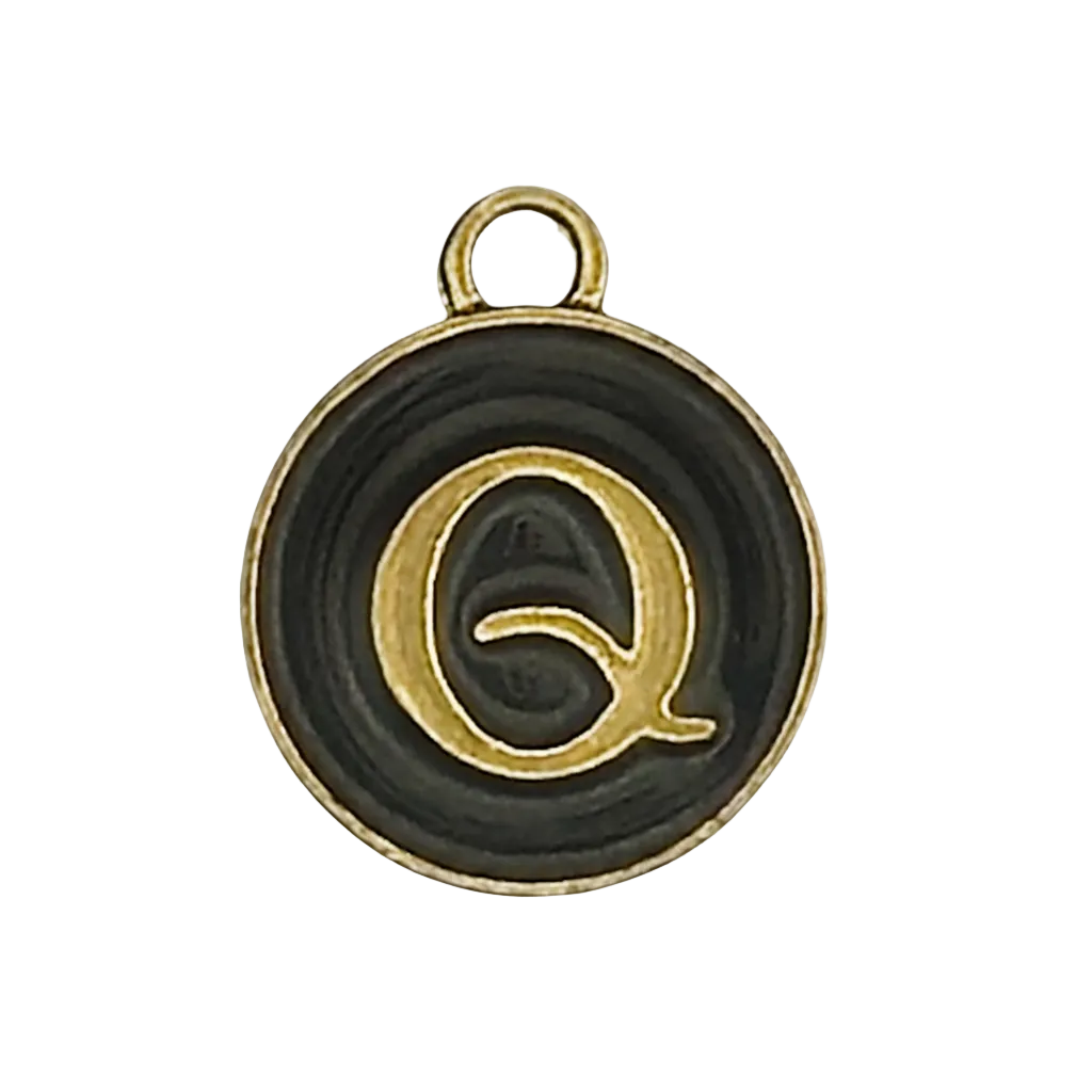 close-up of round black and gold letter Q charm