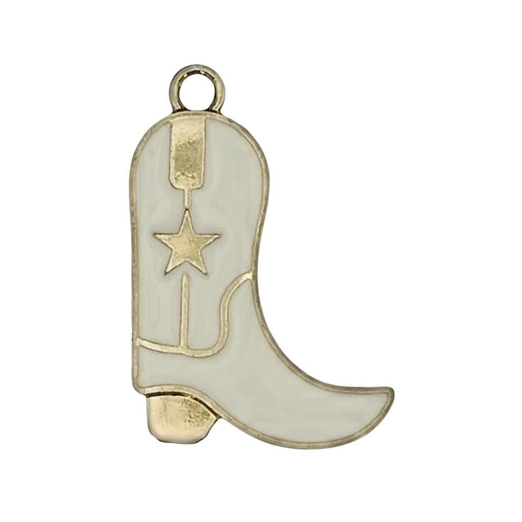 close-up of a white enamel cowboy boot charm with gold star on black background